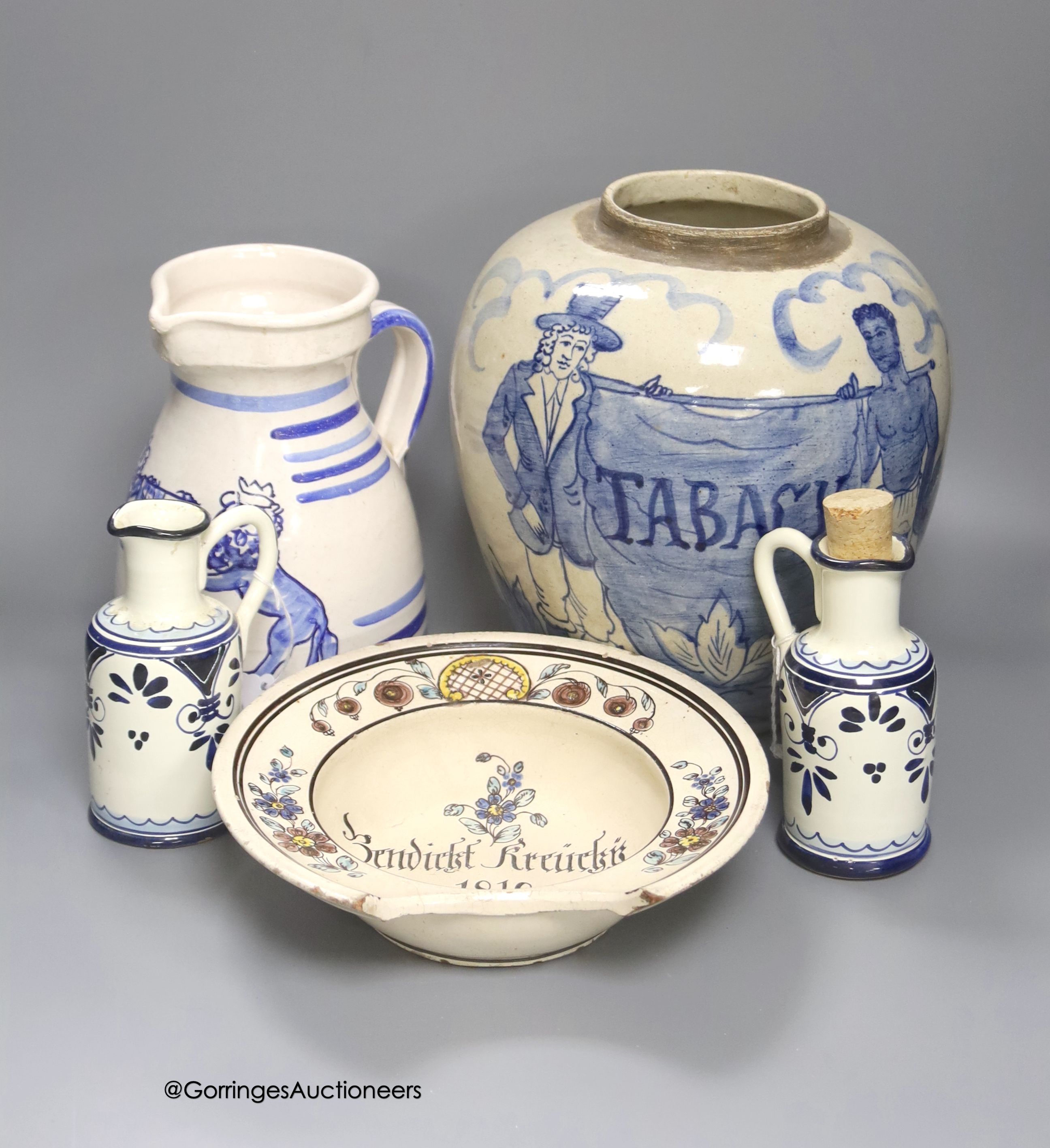 A tin-glazed terracotta barber's bowl dated 1819, a large ovoid eathenware ‘Taback’ jar and three