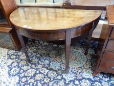 A George III mahogany demi lune drop flap dining table, length 116cm extended, width 118cm, height