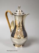A George III silver baluster hot water pot, Charles Wright, London, 1771, height 21.7cm, gross