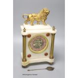 A Victorian alabaster mantel clock, with gilt metal lion surmount, French skeleton movement with