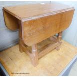 A small 'Beaverman' oak drop leaf occasional table with adzed top, 63cm extended, width 56cm,