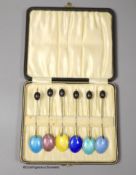 A late 1920's cased set of six continental silver and enamel bean end coffee spoons, import marks