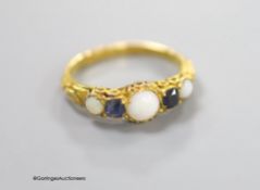 A Victorian 15ct gold, three stone white opal and two stone sapphire set half hoop ring, size L/M,