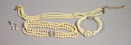A triple strand cultured pearl choker necklace, with gem set clasp, 31cm, two simulated pearl items
