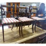 A set of five Regency brass inlaid simulated rosewood cane seated dining chairs