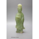 A Chinese green hardstone figure of Guanyin, 29cm
