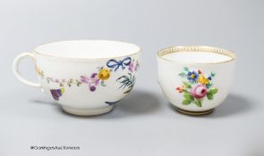 A Meissen bowl, c.1750, moulded and painted with flowers, 6cm diameter and Meissen cup, c.1750