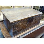 A 17th century carved oak bible box with bible, width 56cm, depth 36cm, height 22cm