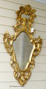 An 19th century style Italian gilt carved wood wall mirror. W-50, H-89