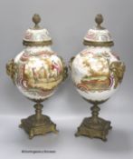 A pair of 19th century German ormolu mounted porcelain jars and covers, 41cm