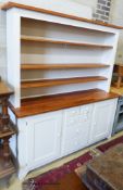 A light green painted kitchen dresser, with pine top and shelves, length 182cm, depth 51cm, height