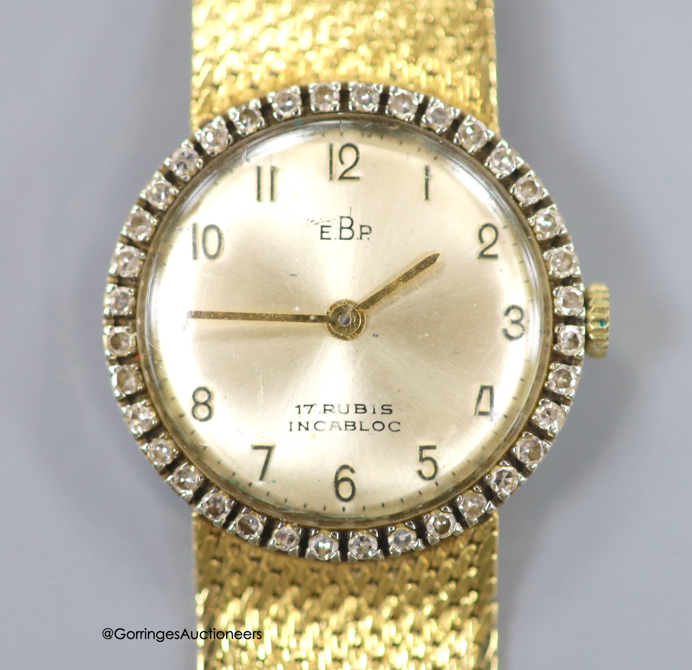 A lady's 18k and diamond set EBP manual wind wrist watch on an integral 750 mesh link bracelet,