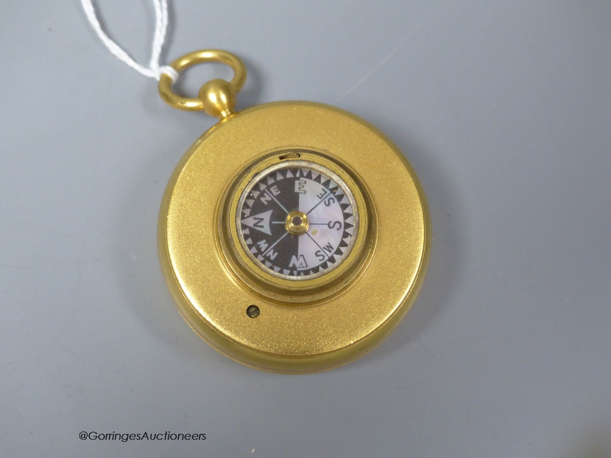 A 19th century gilt brass cased pocket barometer with compass, cased - Image 2 of 2