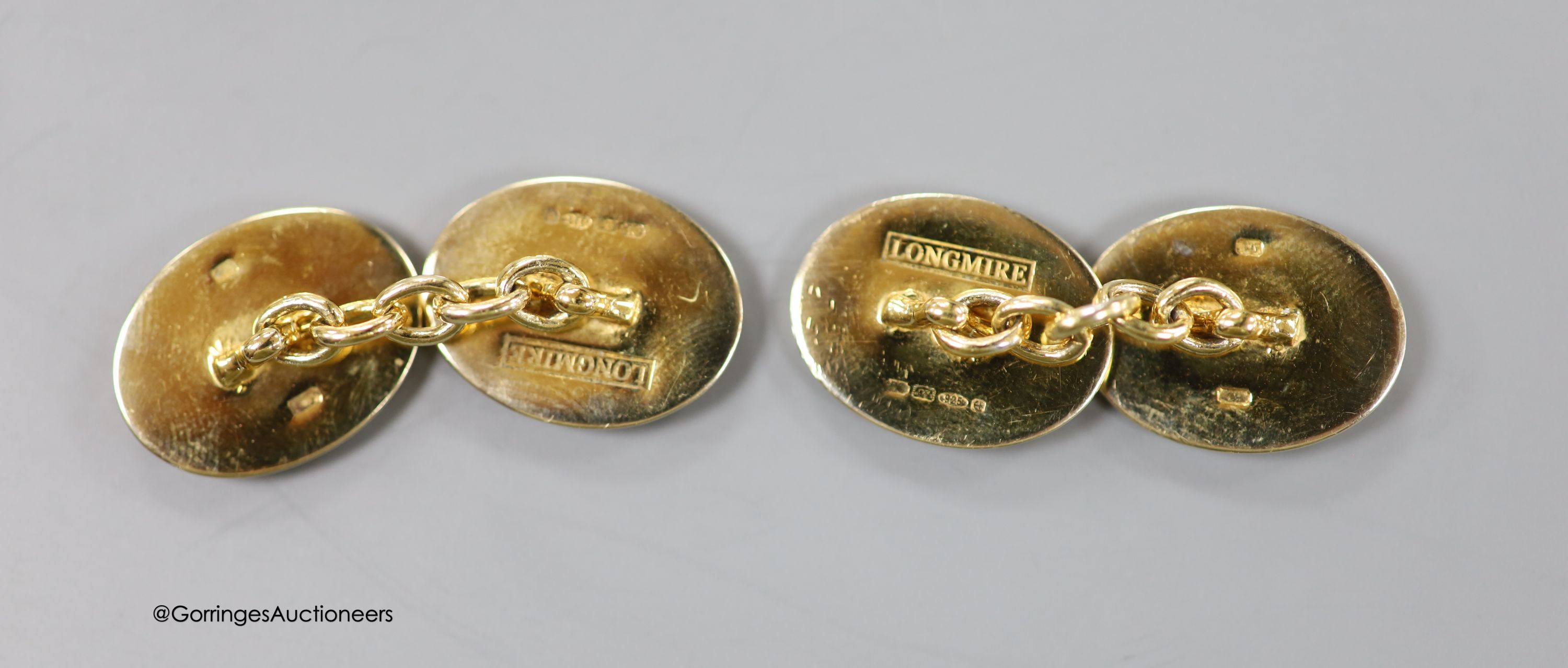 A cased modern pair of silver gilt and enamel Longmire oval cufflinks, decorated with jockey cap - Image 2 of 3