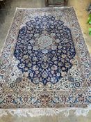 A North West Persian ivory ground carpet, 325 x 203cm
