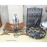 A cast and wrought iron fire grate, spark guard, fire implements, a light fitting and wall lights