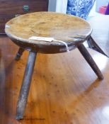 A 19th century primitive fruitwood stool. D-30, H-25cm.
