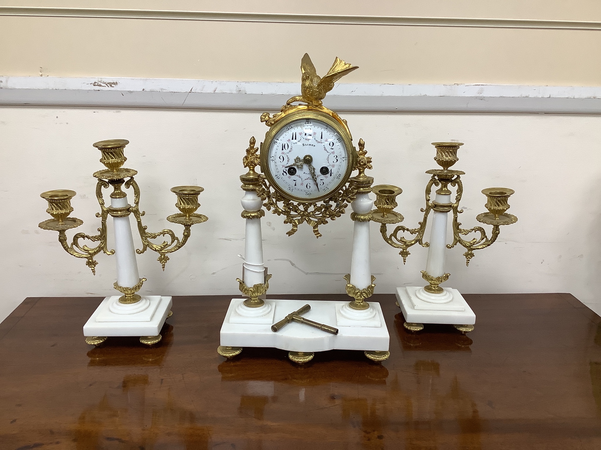 A French white marble and ormolu clock garniture, c.1900, no pendulum