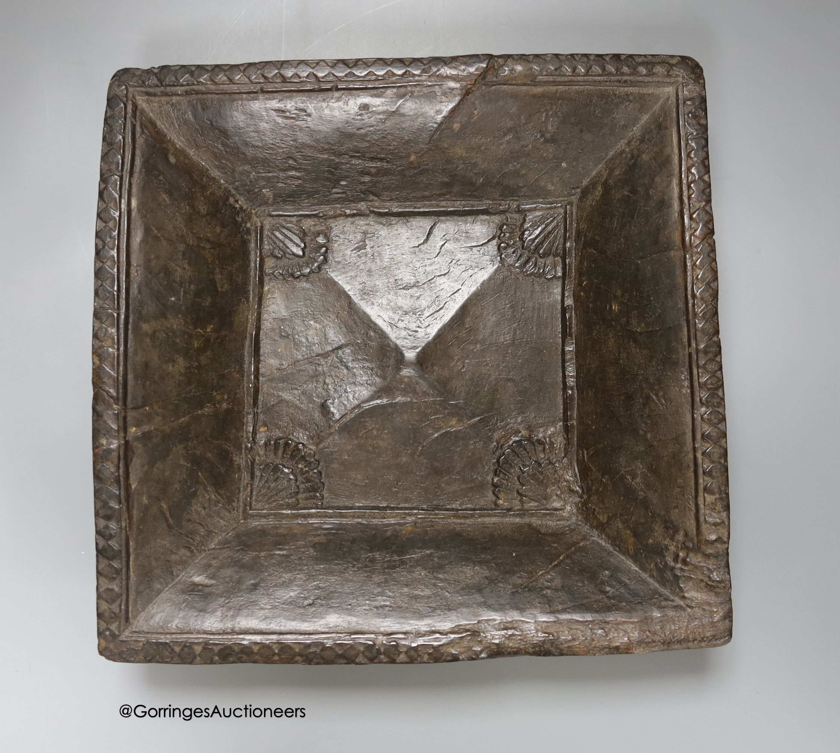 An early square wood tray, carved from the solid, possibly Spanish chestnut, 30cm, and a pair of - Image 3 of 4