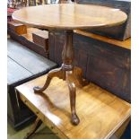 An early 19th century mahogany circular tilt top tripod tea table, diameter 74cm, height 72cm