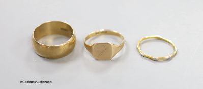 Two 9ct rings including a signet ring, 10 grams and one other two colour metal ring.