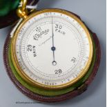 A 19th century gilt brass cased pocket barometer with compass, cased