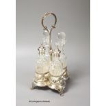 A 20th century Portuguese silver cruet stand, with four bottles, two with silver mounts, Oporto