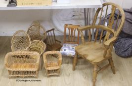 A wicker settle and six wicker chairs for display, together with a child's modern Windsor chair and