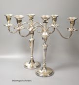 A modern pair of silver two branch, three light candelabra by C.J. Vander Ltd, Sheffield, 1962 &