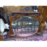 A late Victorian mahogany overmantel mirror, width 135cm, height 100cm