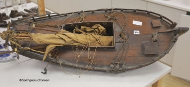 A 19th century clinker-built wood model sailing boat, single masted with main sail and boom, 96cm