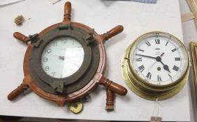 A brass bulkhead timepiece, enamelled dial signed Story, Barrow, dial 17cm, and a ship's wheel wall