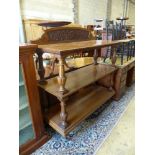 A late Victorian oak three tier buffet, length 136cm, depth 54cm, height 140cm