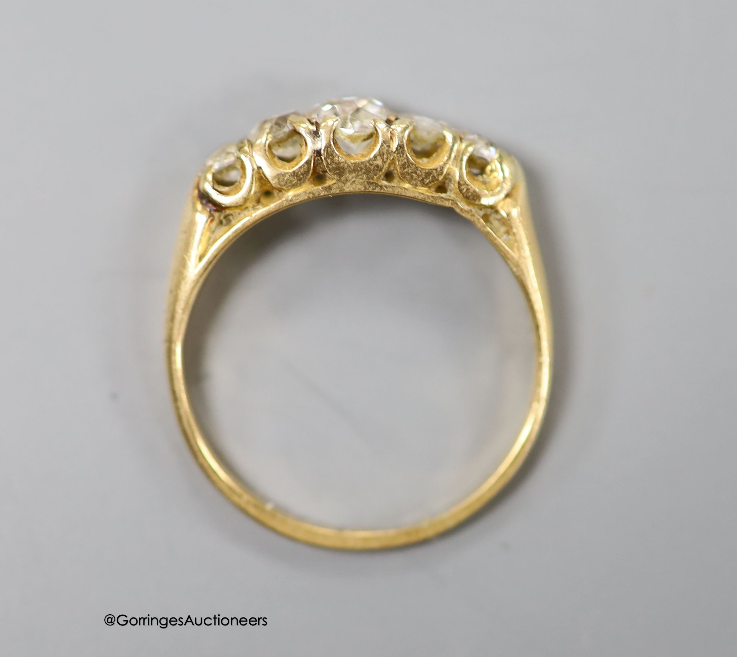 An 18ct and graduated five stone diamond set half hoop ring, size L, gross 2.6 grams. - Image 3 of 3