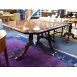 A Harrod's Regency style twin tri-pillar mahogany extending dining table, length 166cm, depth