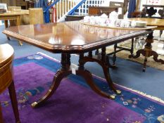 A Harrod's Regency style twin tri-pillar mahogany extending dining table, length 166cm, depth