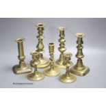 A quantity of brass candlesticks
