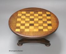 An Apprentice made miniature mahogany, rosewood and satiwnood tilt top games table, diameter 27cm