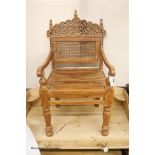 An Anglo-Indian carved hardwood elbow chair, width 55cm, depth 48cm, height 98cm