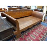 An Indian carved teak day bed, length 220cm, width 87cm, height 89cm