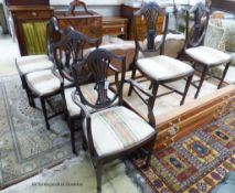 A set of six Hepplewhite style mahogany dining chairs, two with arms