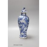 A 19th century Chinese blue and white 'prunus' vase and cover, height 33cm