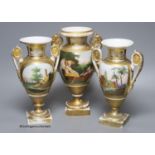 A 19th century French porcelain garniture of three vases, height 27cm