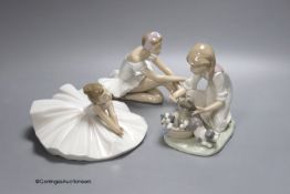 A Lladro figure of a ballerina and a child playing with dogs, height 21cm, and a Nao ballerina