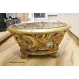 A carved wood and giltwood jardiniere, metal liner, length 54cm