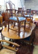 A set of six Hepplewhite style mahogany dining chairs (two with arms) and a George III style