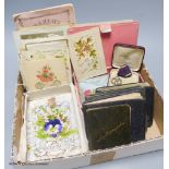 A collection of early 20th century greetings cards, Valentine's cards, autograph albums etc