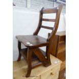 A reproduction mahogany metamorphic library chair