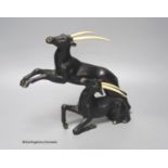 A painted bronzed spelter and ivorine antelope, in the style of Raoh Schorr, height 24cm