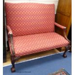 A George III style carved mahogany settee, on cabriole legs, length 130cm, depth 74cm, height 110cm